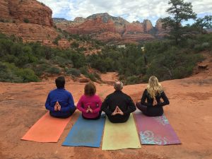 yoga hiking in sedona prayer behind back